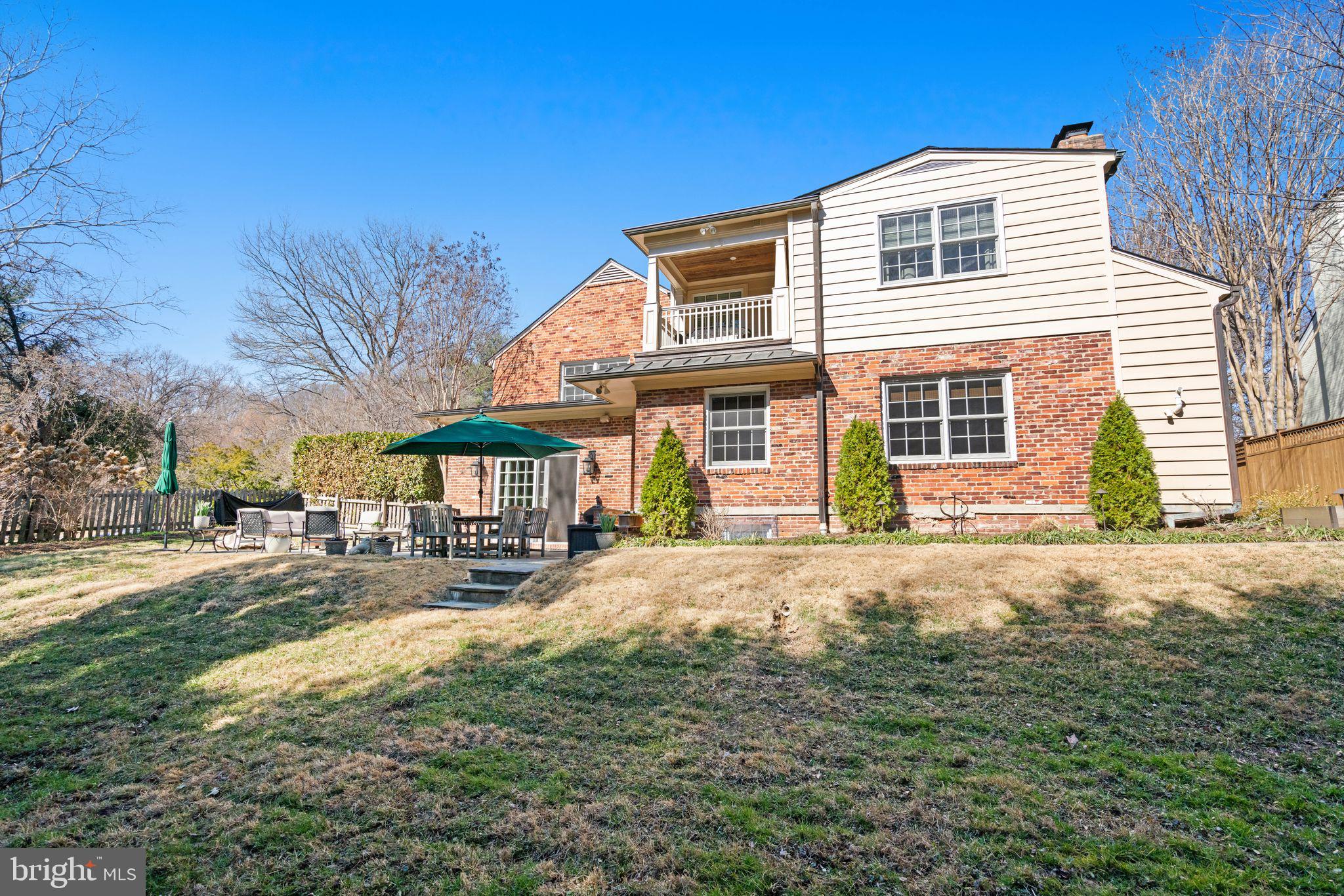 5310 Elliott Road Bethesda, MD 20816 - Photo 87 of 89 a front view of a house with a yard and garage