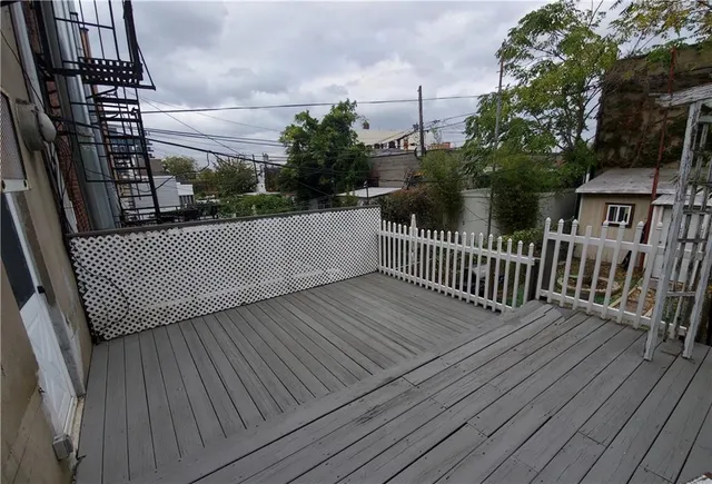 a view of balcony with wooden floor