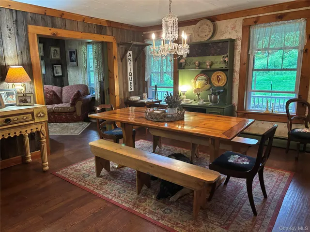 a work room with furniture and a window
