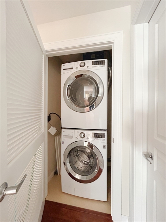 4 Repton Place, Unit 4415 Watertown, MA 02472 - Photo 17 of 25 a utility room with dryer and washer