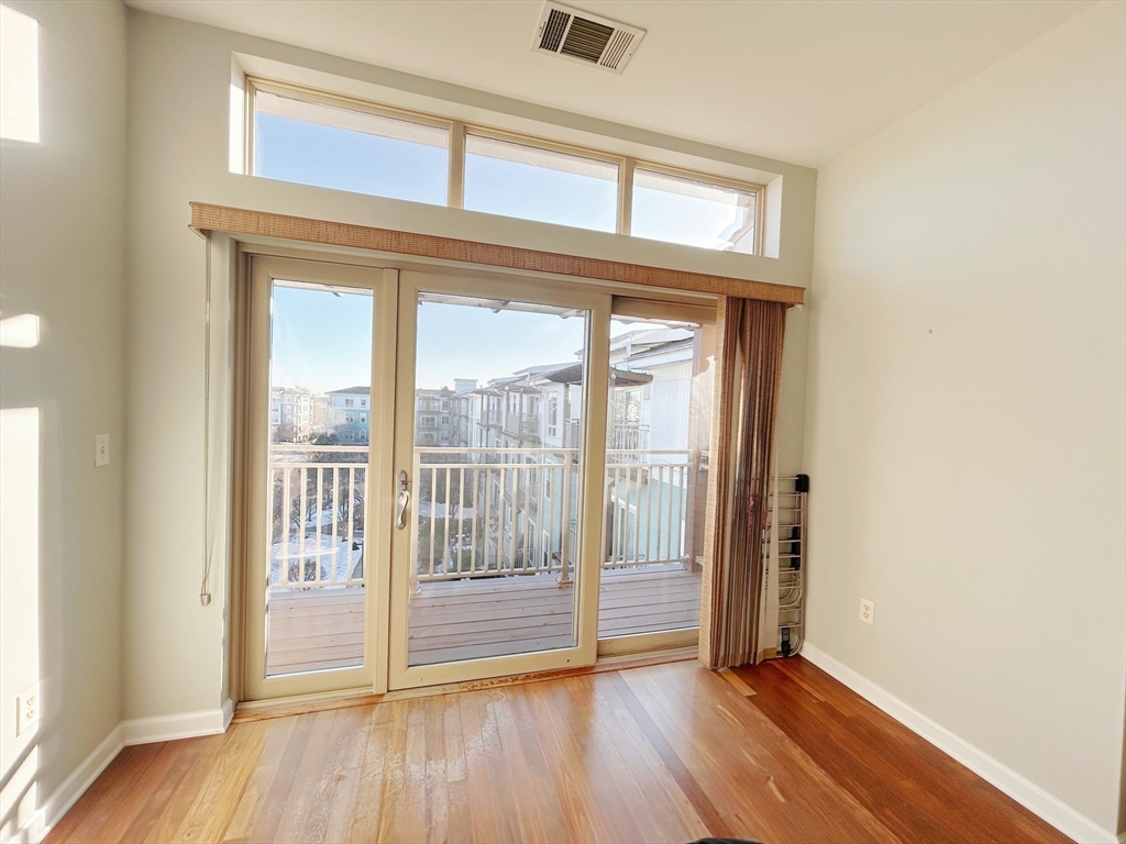 4 Repton Place, Unit 4415 Watertown, MA 02472 - Photo 18 of 25 a view of front door with wooden floor