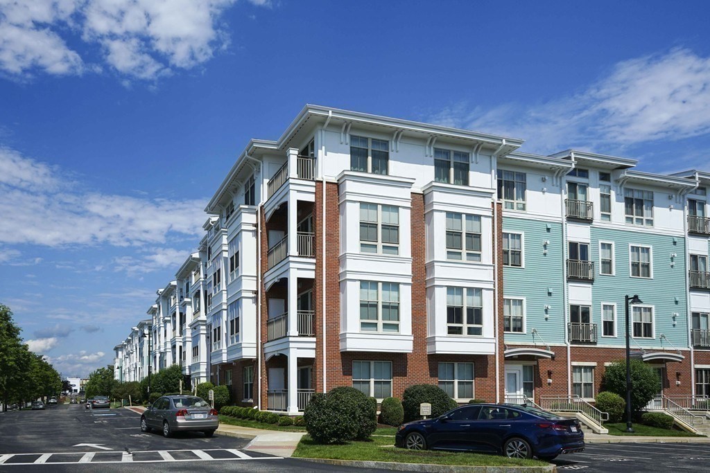 4 Repton Place, Unit 4415 Watertown, MA 02472 - Photo 21 of 25 a front view of a building with street view