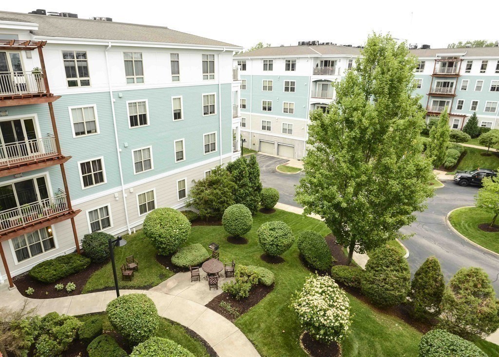 4 Repton Place, Unit 4415 Watertown, MA 02472 - Photo 22 of 25 a view of a street with a building in the background