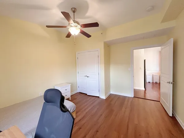 a bedroom with a bed and cabinets