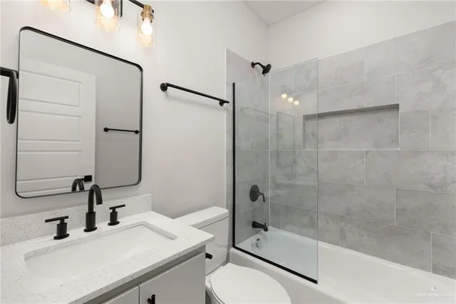 a view of a backyard with plants and a garden