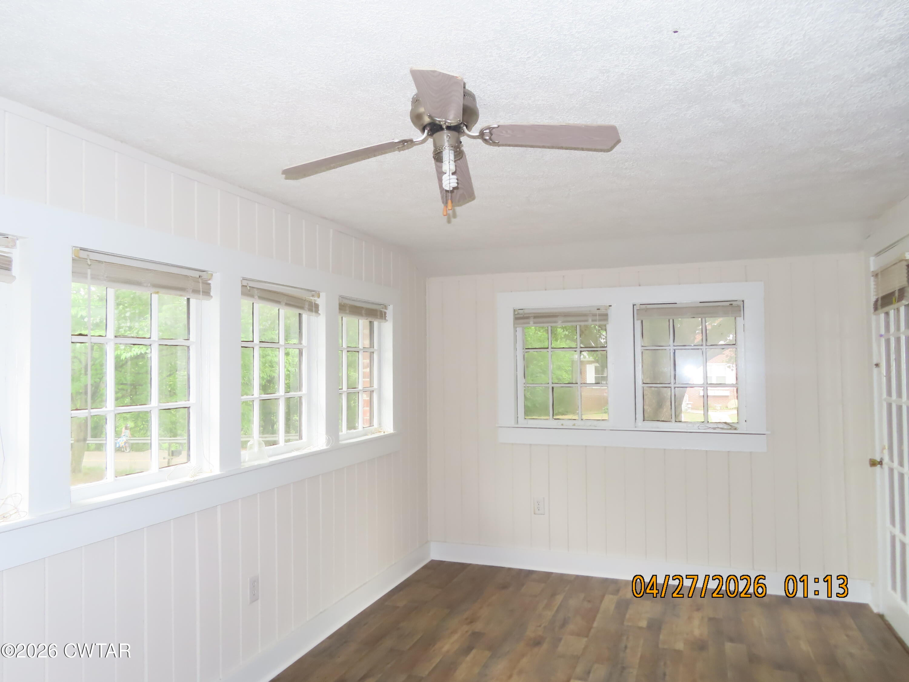 43 Bemis Lane Jackson, TN 38301 - Photo 12 of 18 a view of an empty room with wooden floor and a window