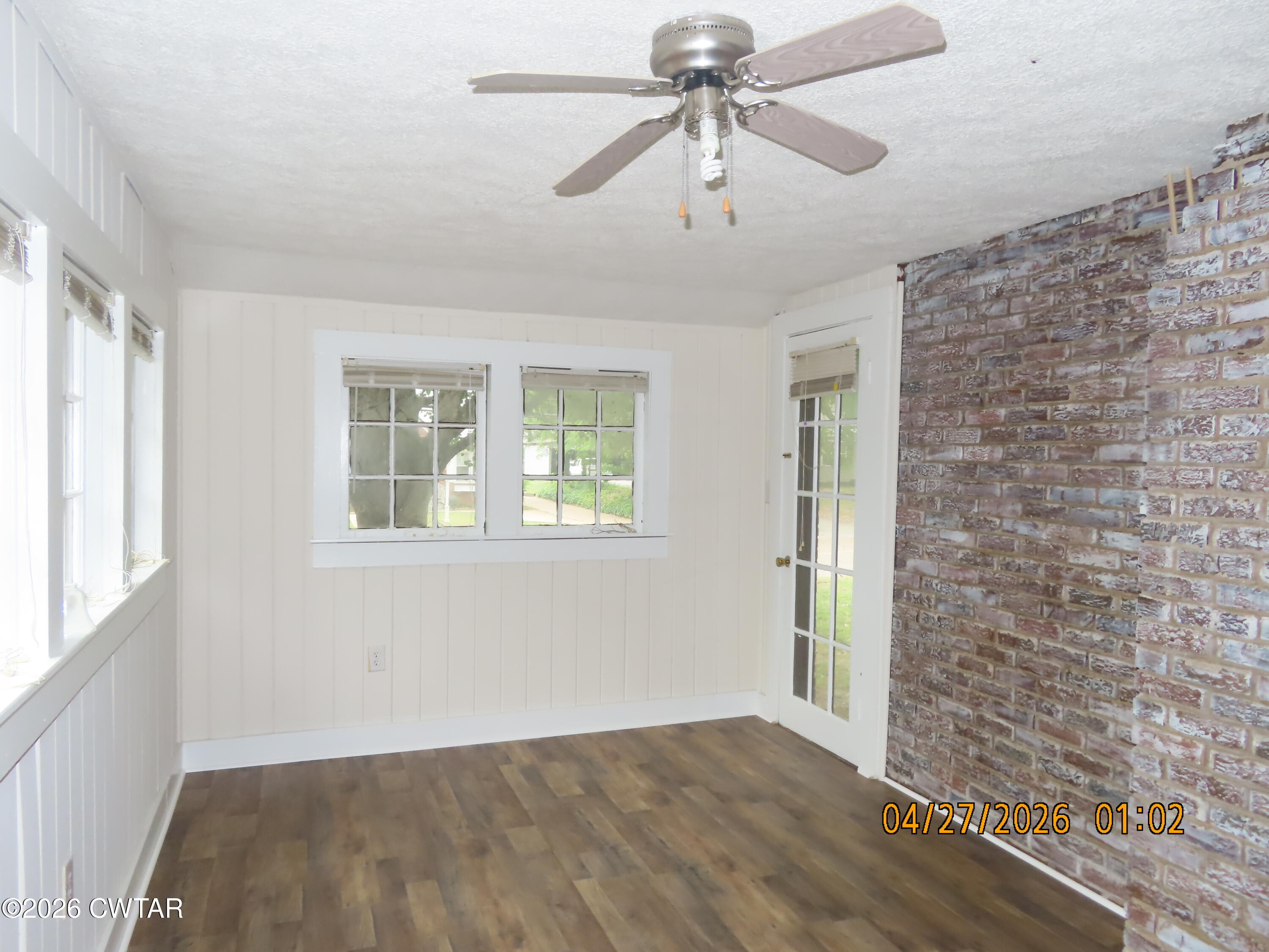 43 Bemis Lane Jackson, TN 38301 - Photo 13 of 18 a view of an empty room with a window and wooden floor