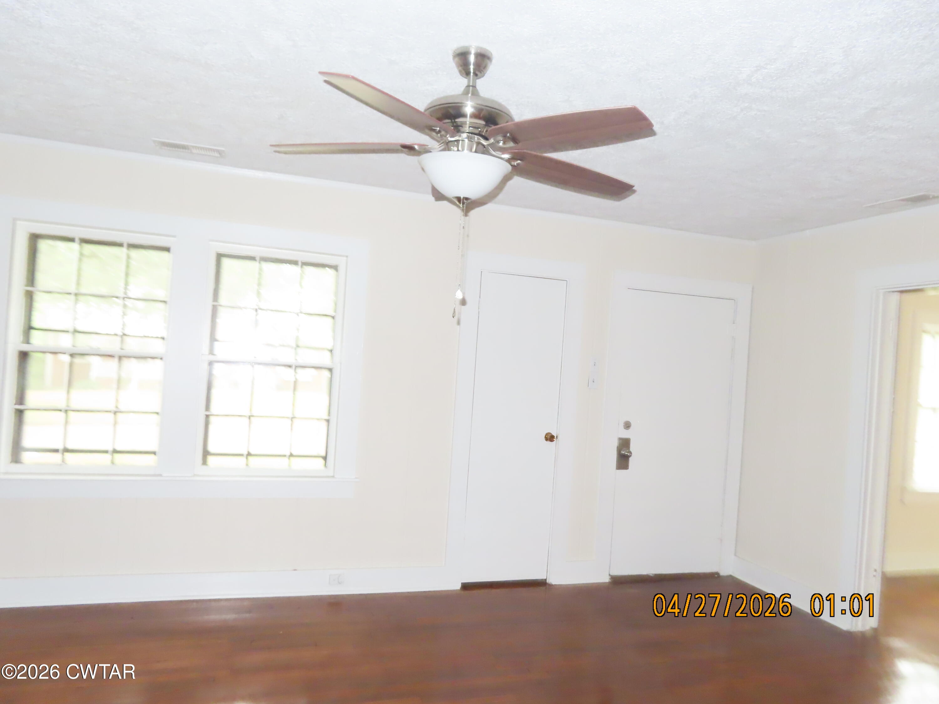 43 Bemis Lane Jackson, TN 38301 - Photo 2 of 18 a view of empty room with wooden floor and fan