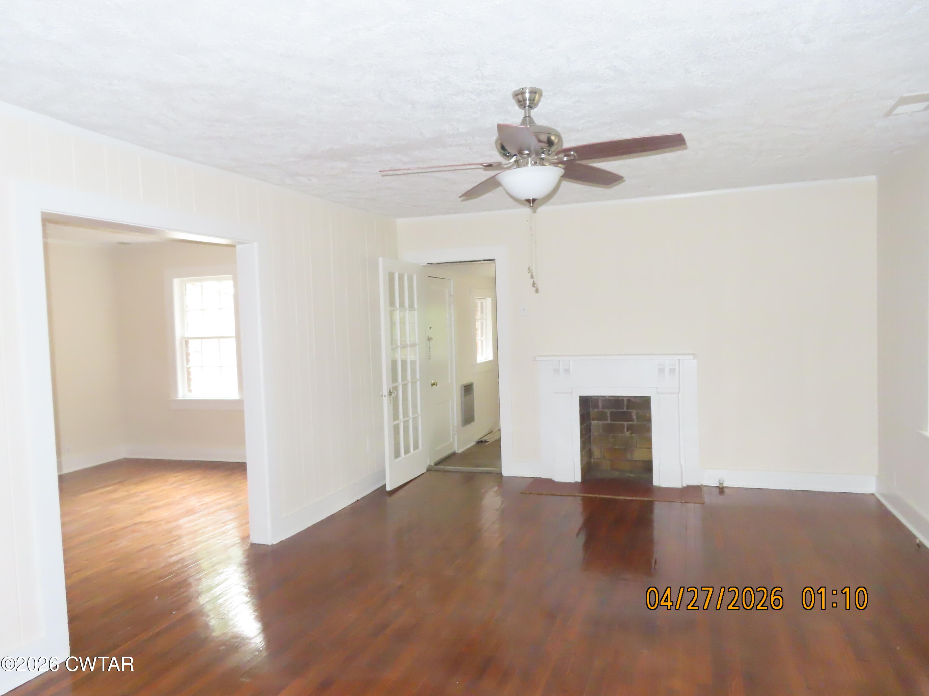 43 Bemis Lane Jackson, TN 38301 - Photo 4 of 18 a view of an empty room with wooden floor and a window