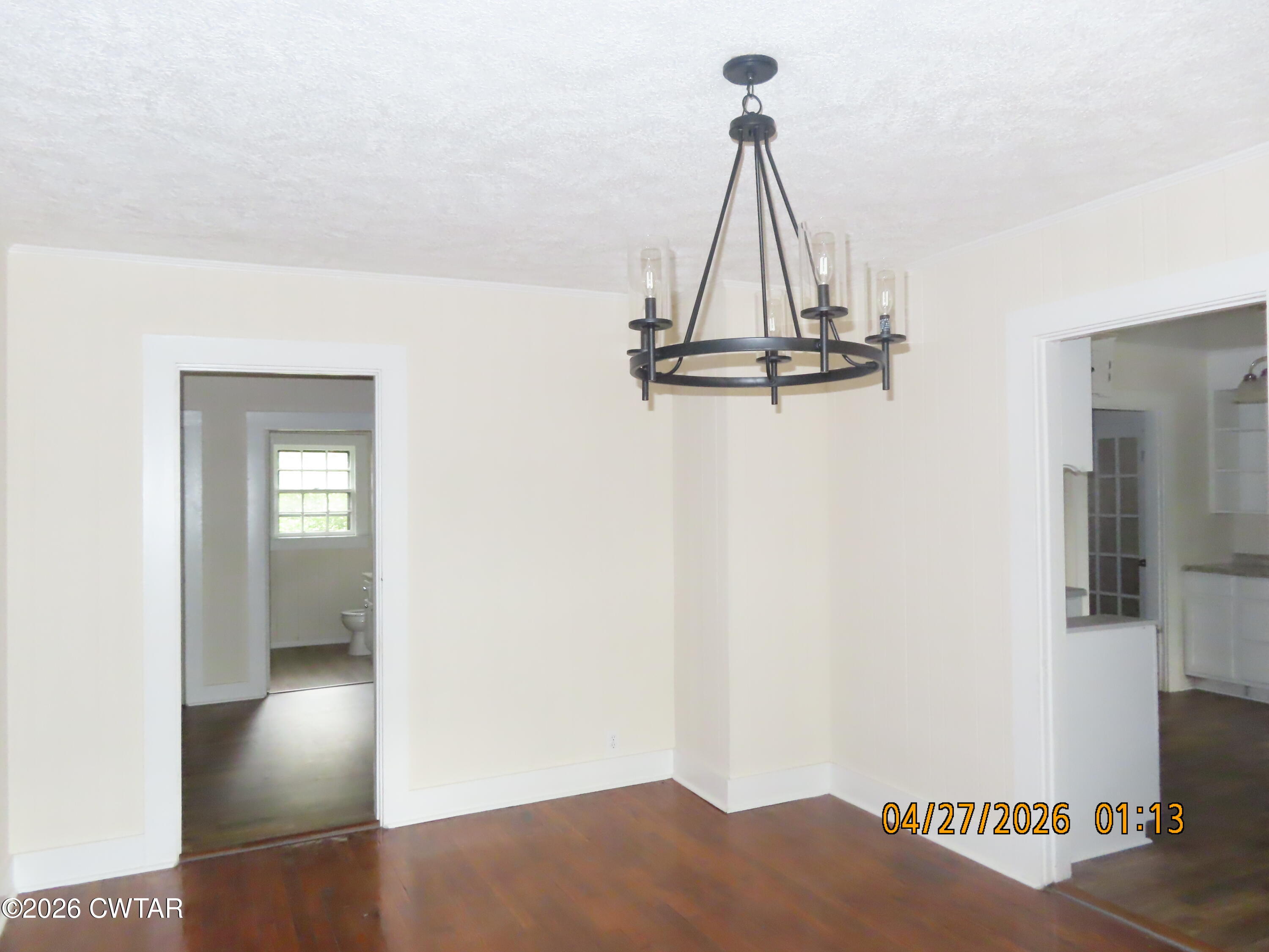 43 Bemis Lane Jackson, TN 38301 - Photo 5 of 18 a view of a hallway with wooden floor and a bathroom