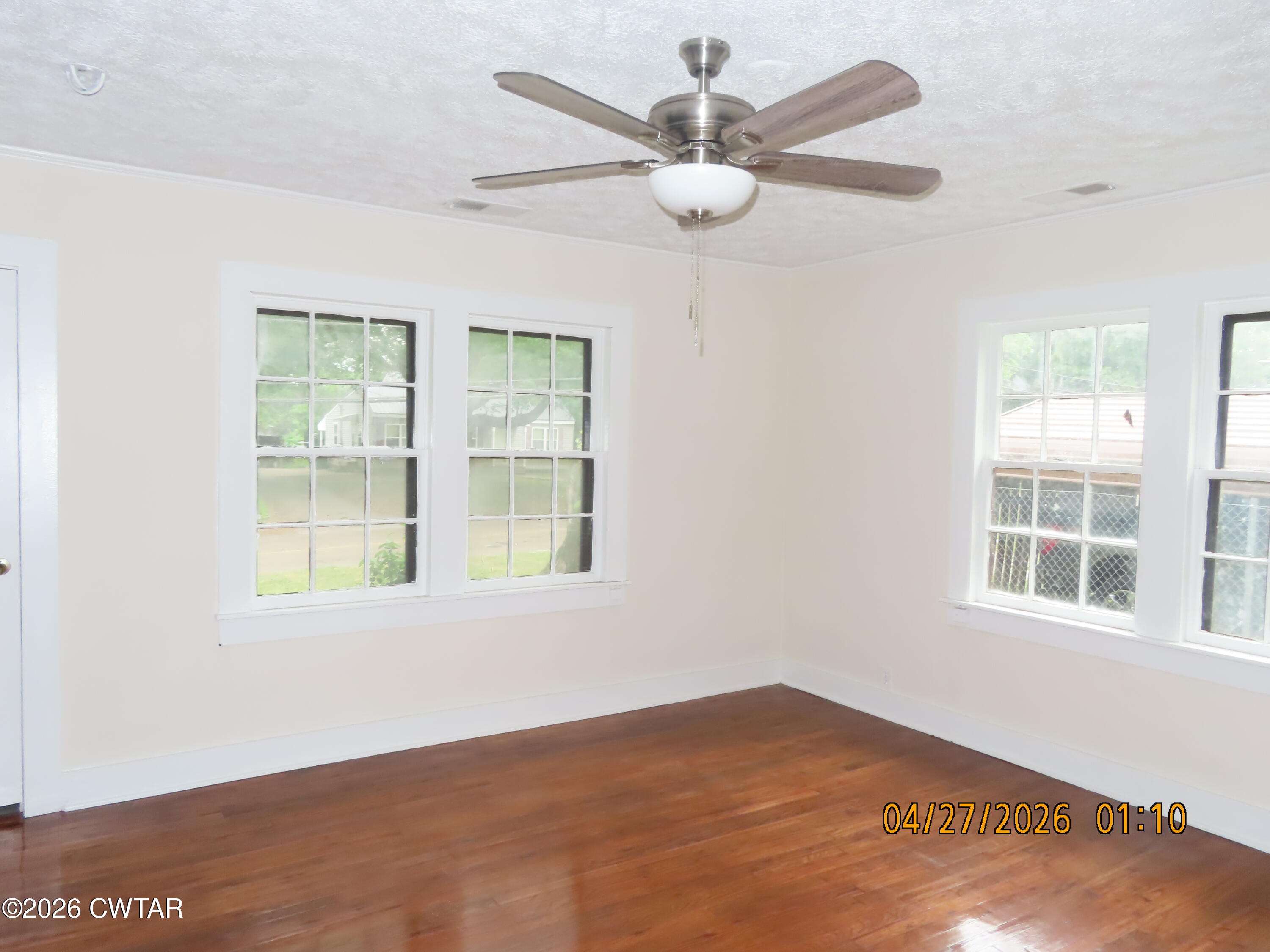 43 Bemis Lane Jackson, TN 38301 - Photo 9 of 18 an empty room with windows and fan