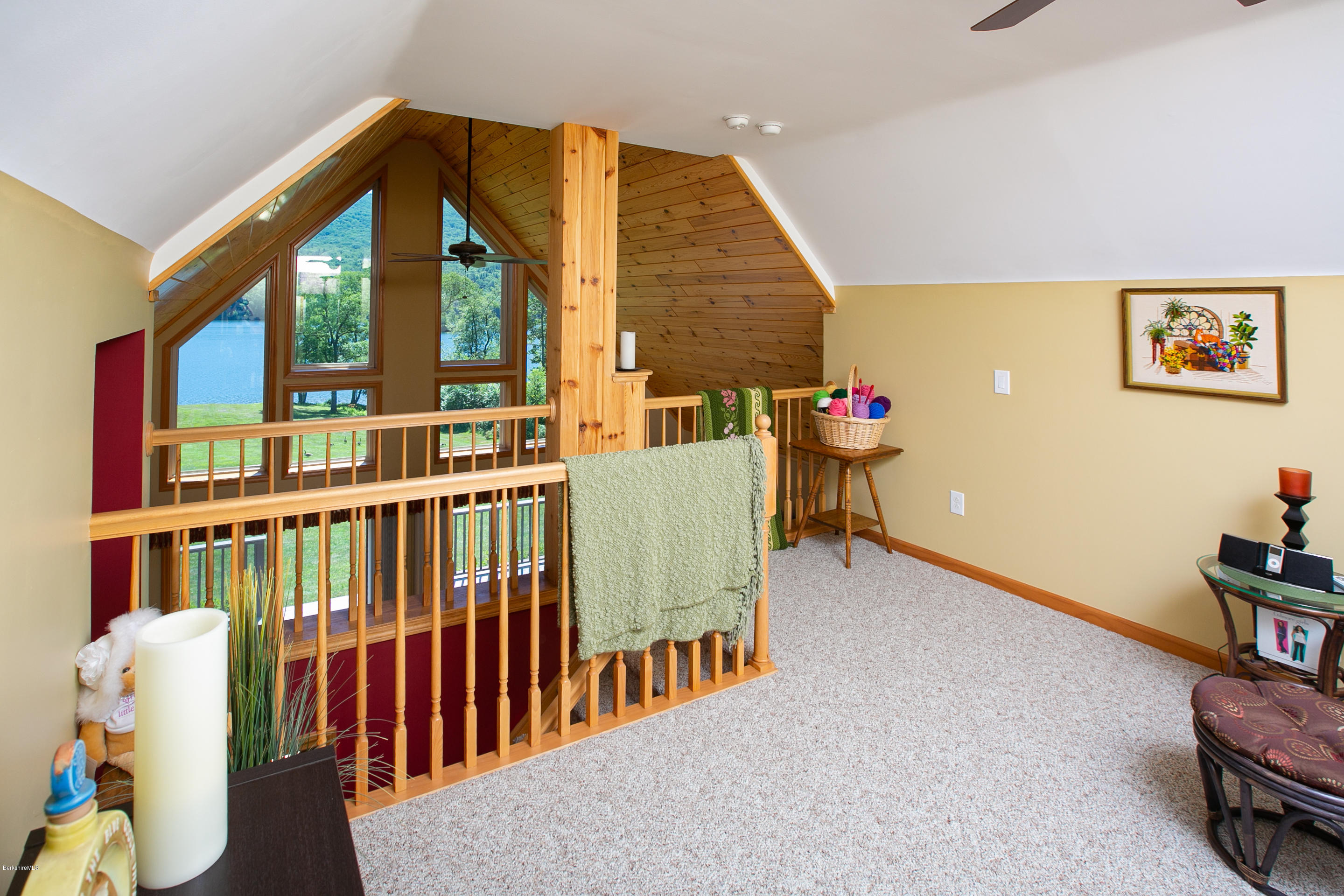 595 Lanesboro Road Cheshire, MA 01225 - Photo 11 of 32 a living room with furniture stairs and a baby crib