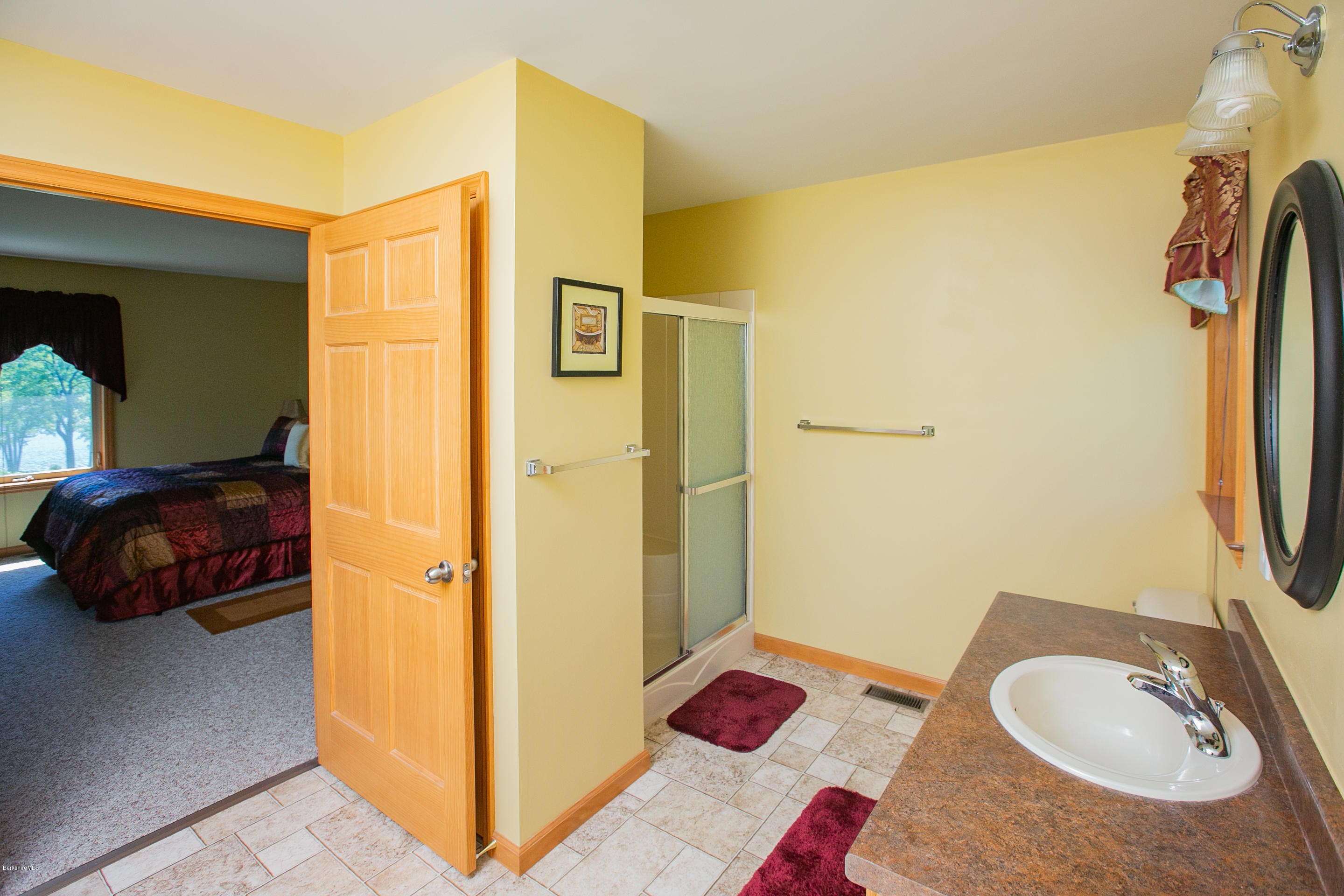 595 Lanesboro Road Cheshire, MA 01225 - Photo 17 of 32 a bathroom with a sink and a mirror