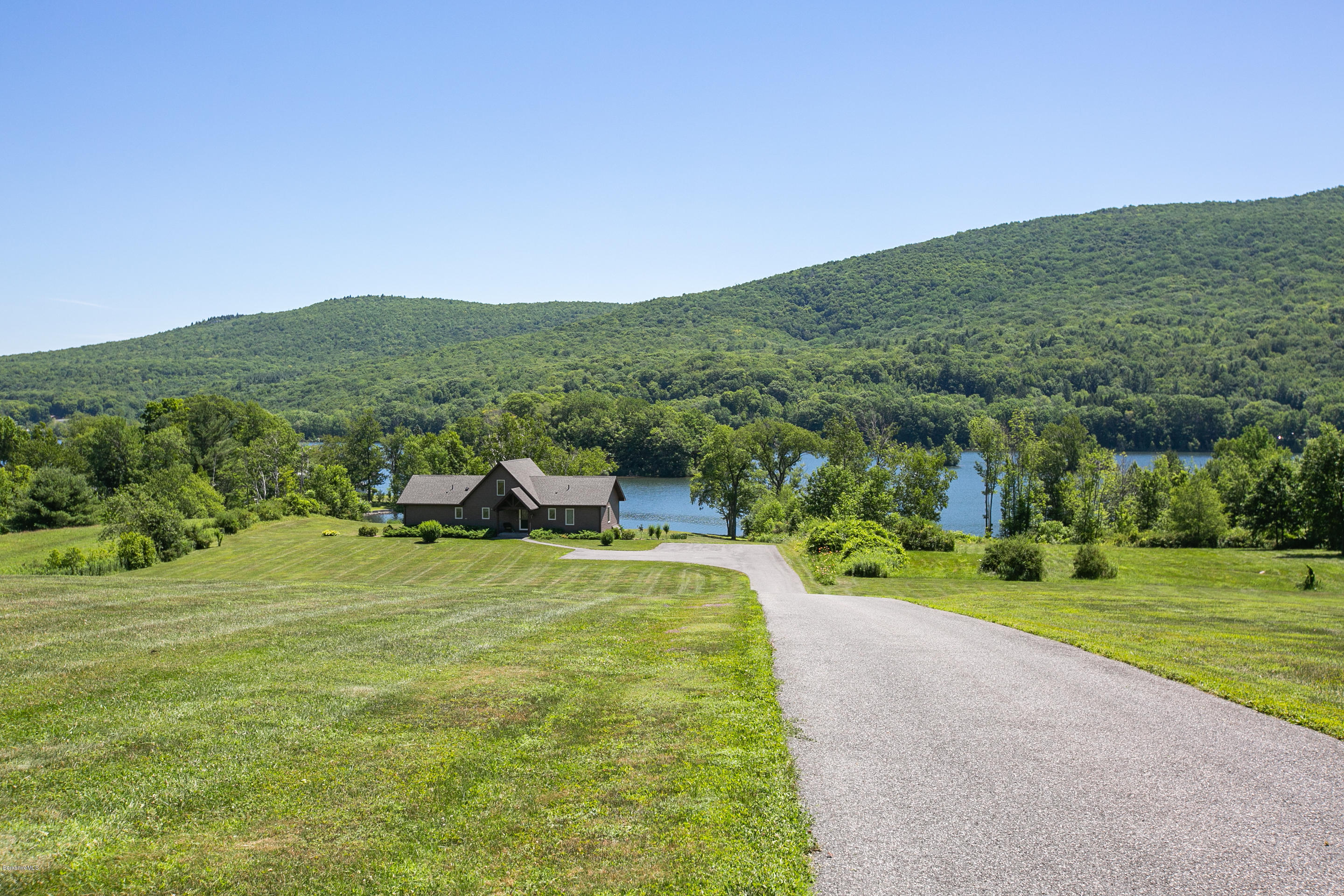 595 Lanesboro Road Cheshire, MA 01225 - Photo 3 of 32 a view of a grassy area with an trees