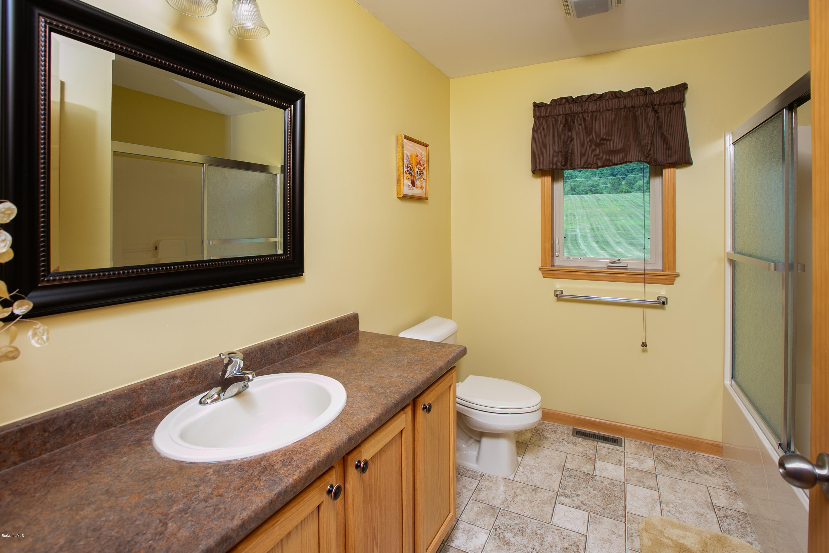 595 Lanesboro Road Cheshire, MA 01225 - Photo 23 of 32 a bathroom with a granite countertop sink and a mirror