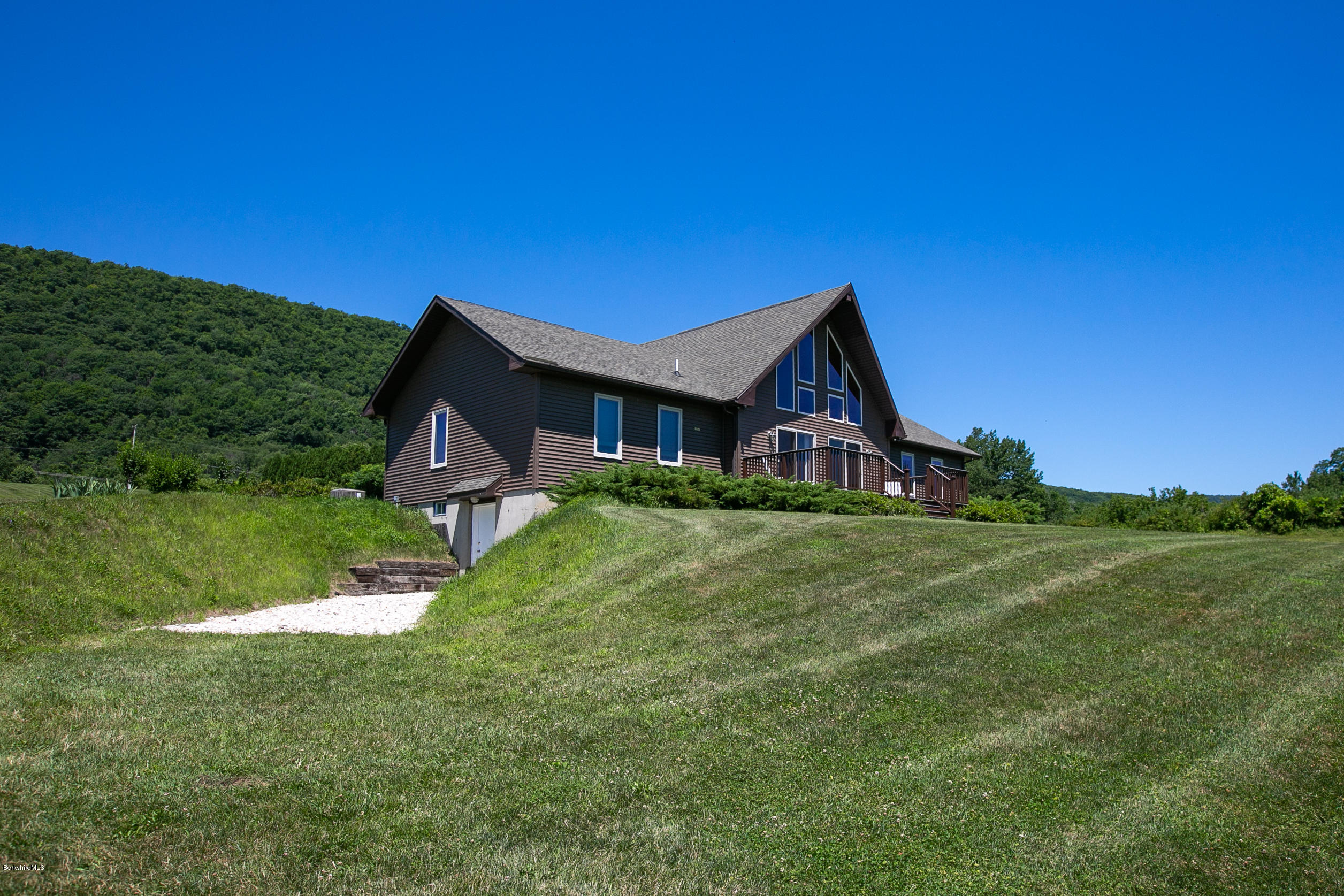 595 Lanesboro Road Cheshire, MA 01225 - Photo 24 of 32 a front view of a house with garden