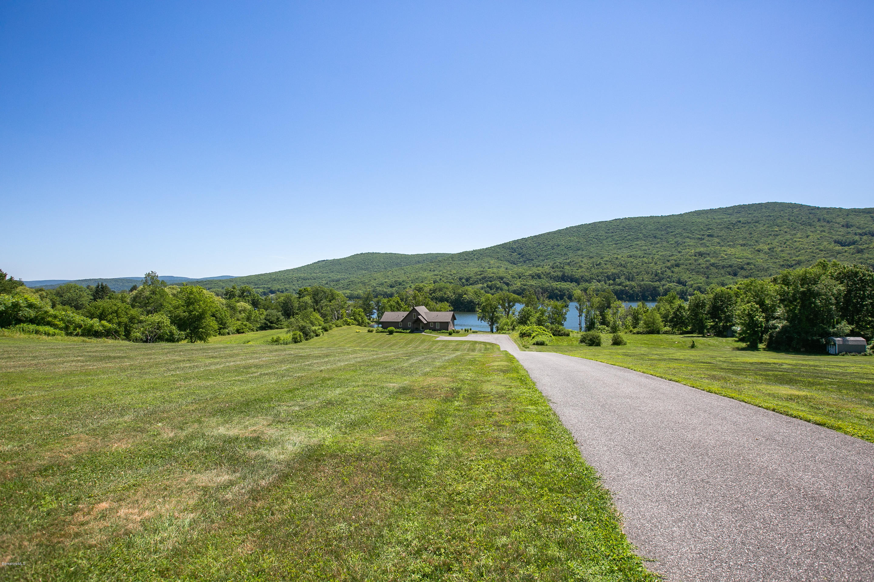 595 Lanesboro Road Cheshire, MA 01225 - Photo 26 of 32 a view of a grassy area with an ocean