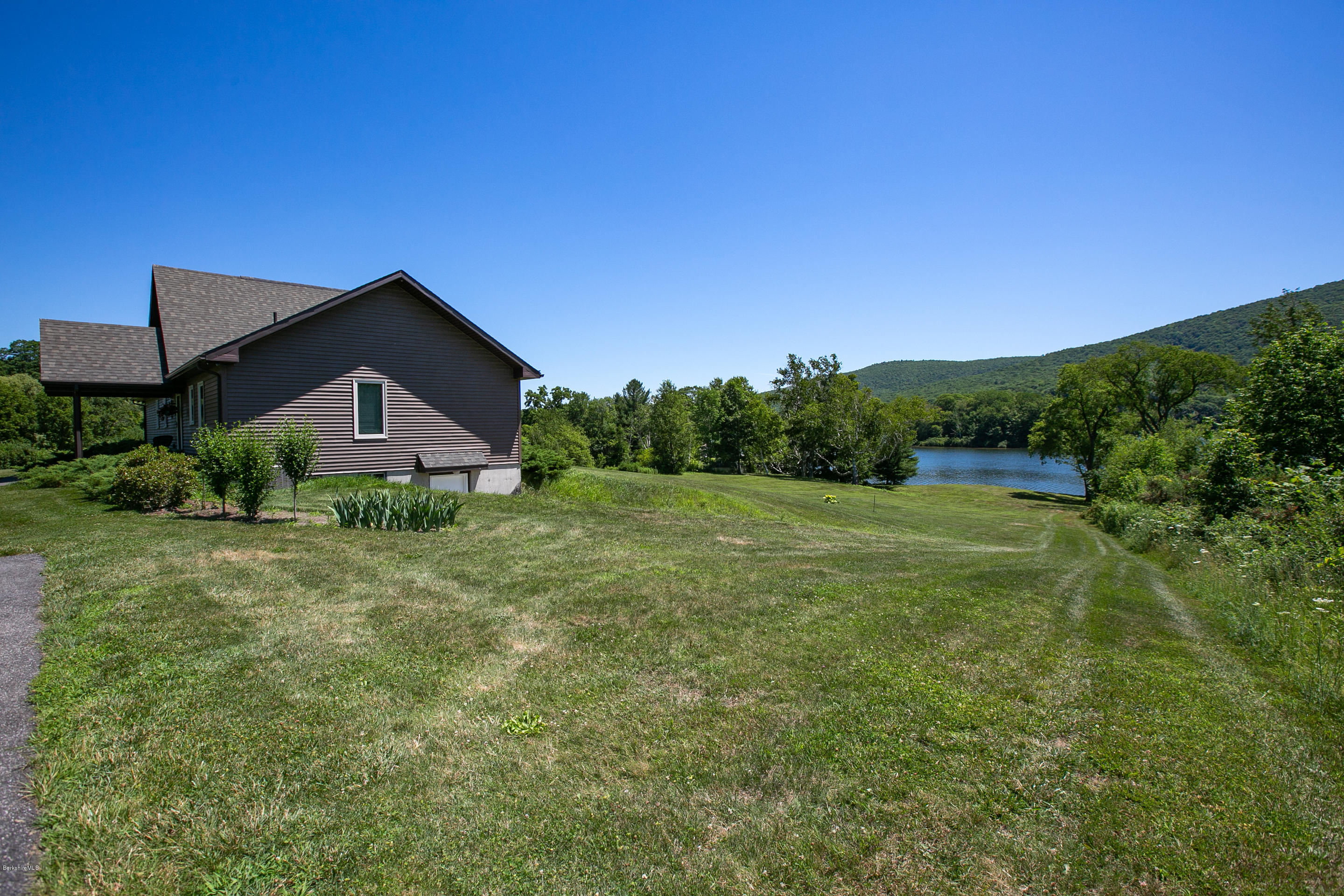 595 Lanesboro Road Cheshire, MA 01225 - Photo 27 of 32 a house view with a garden space