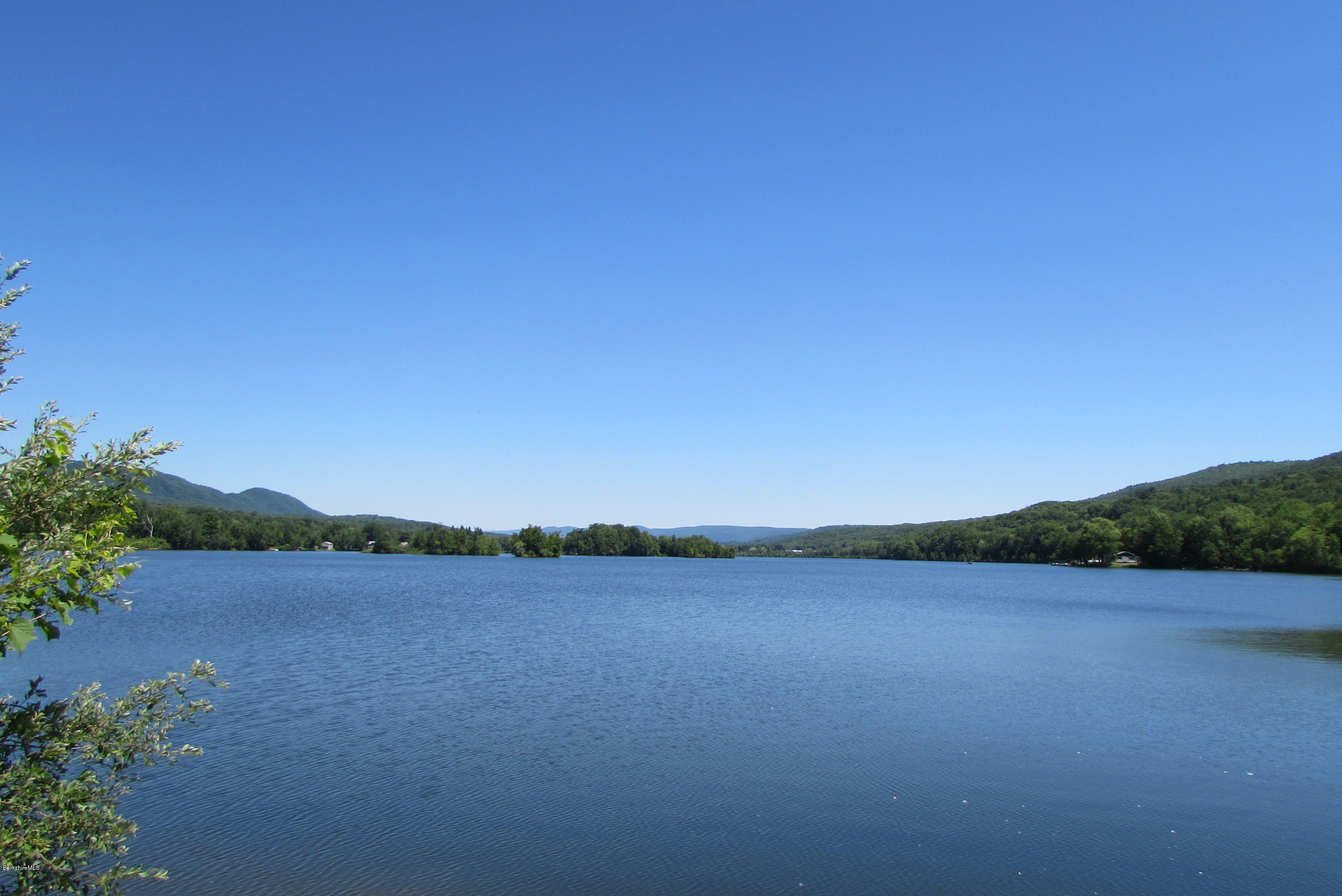 595 Lanesboro Road Cheshire, MA 01225 - Photo 32 of 32 a view of a lake and a yard