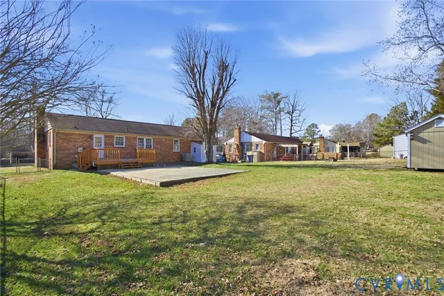 a view of a house with a yard and garage