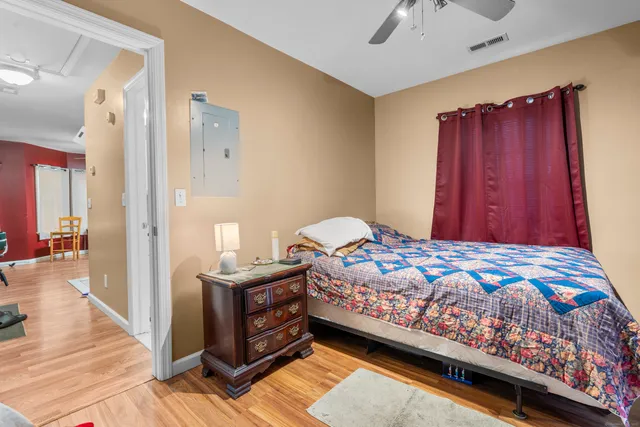 a bedroom with a bed and a window