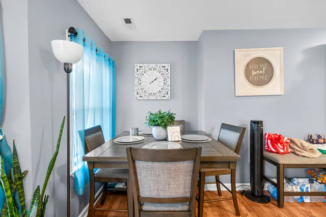 a view of a dining room with furniture and window