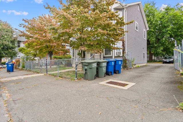 a view of backyard with large trees