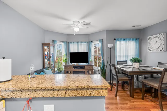 a workspace with furniture and wooden floor