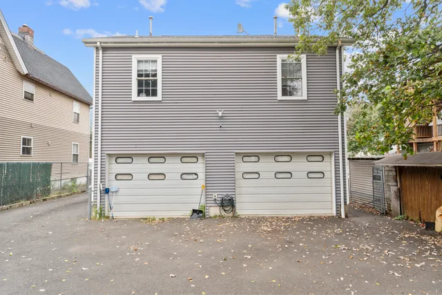 a view of car parked in front of a house