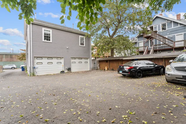 a view of street with parked cars