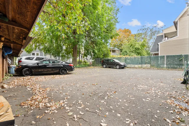 a view of a house with backyard porch and sitting area