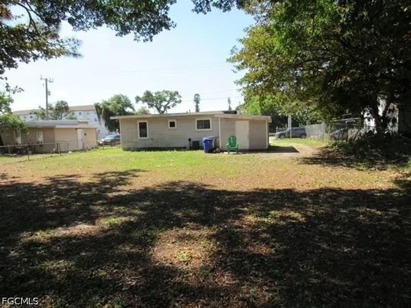 a backyard of a house with a yard and garage