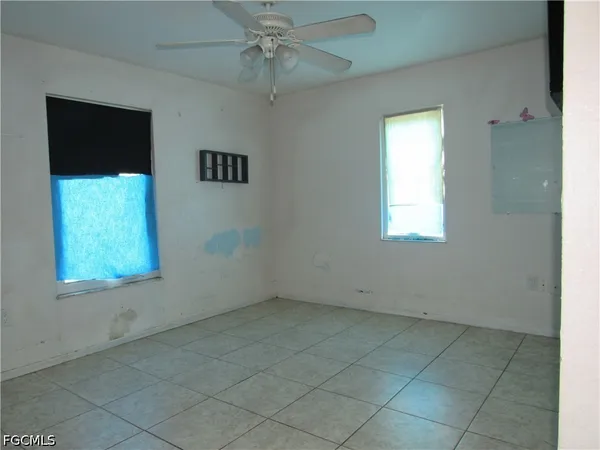 a view of an empty room with a window