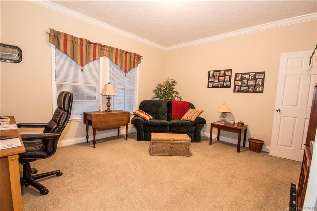 423 Ridgedale Road Clyde, NC 28721 - Photo 8 of 19 a living room with furniture and a chair