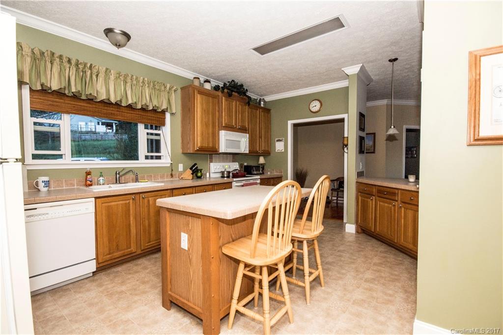 423 Ridgedale Road Clyde, NC 28721 - Photo 10 of 19 a kitchen with a sink appliances and cabinets