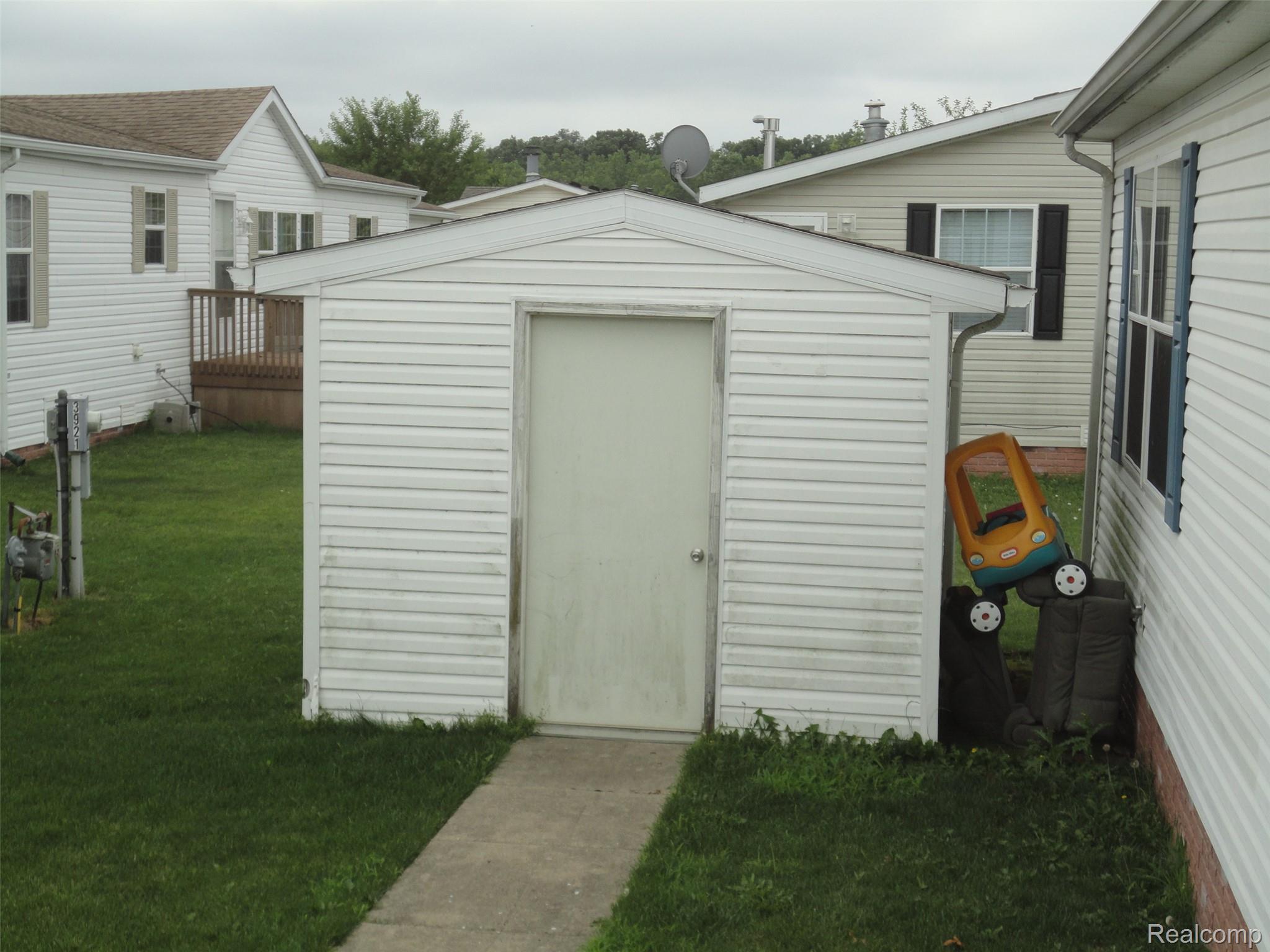 5931 Megans Ridge Monroe, MI 48161 - Photo 4 of 13 Detached storage shed with horizontal siding and a single entry door