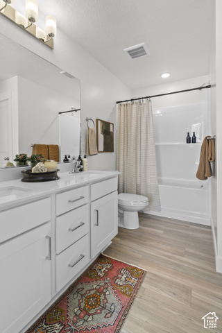 276 West 3075th Street South Logan, UT 84321 - Photo 28 of 33 Double vanity with white cabinetry, rectangular undermount sinks, and light-toned countertops