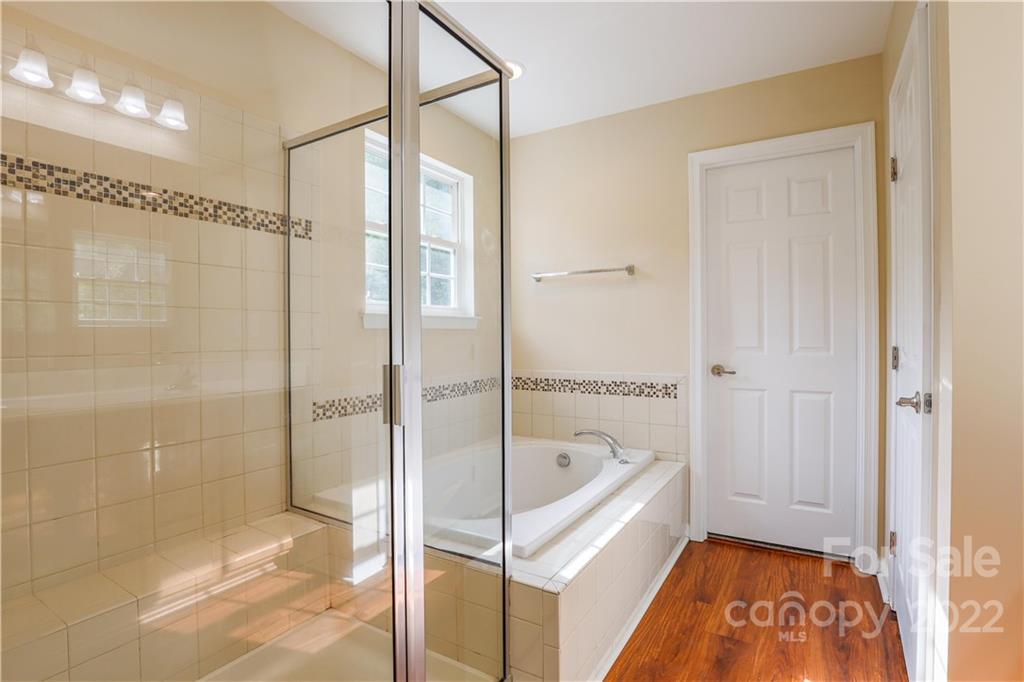 6154 Trotters Ridge Road Charlotte, NC 28227 - Photo 21 of 28 a bathroom with a tub and shower