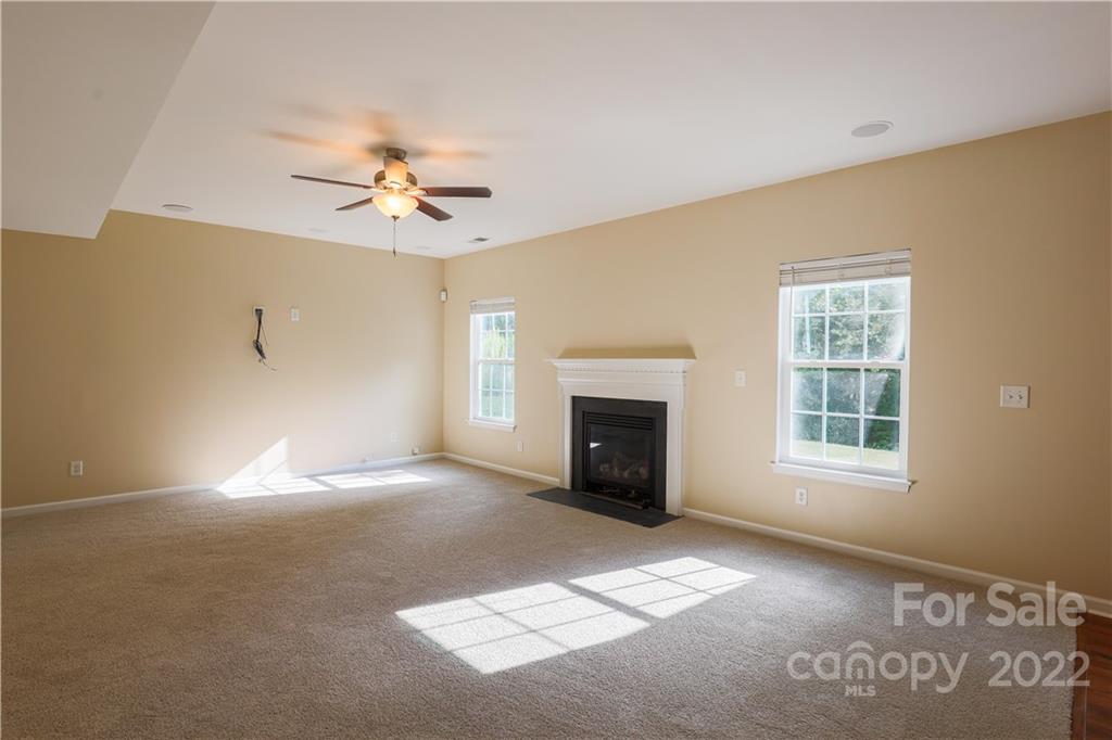 6154 Trotters Ridge Road Charlotte, NC 28227 - Photo 5 of 28 a view of empty room with a fireplace