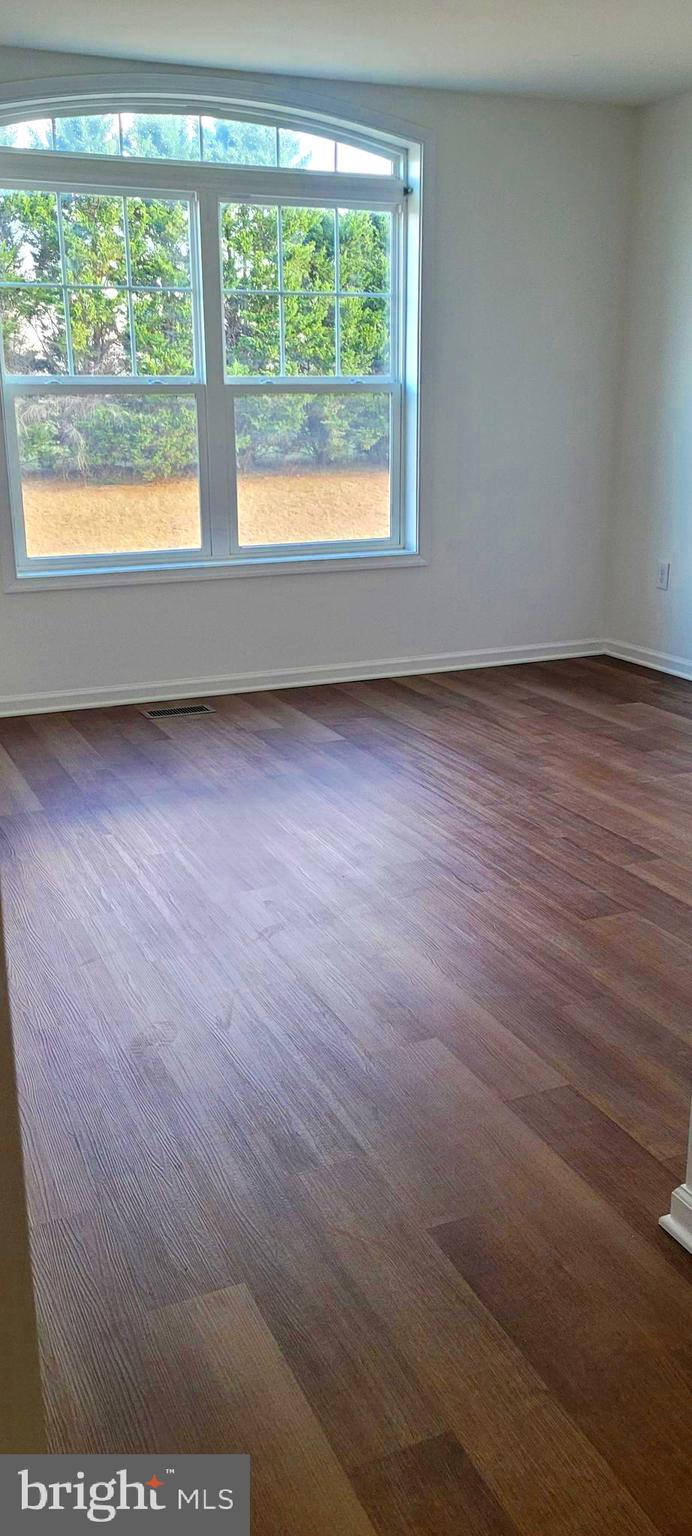 4163 Telegraph Road Elkton, MD 21921 - Photo 12 of 23 a view of an empty room with wooden floor and a window