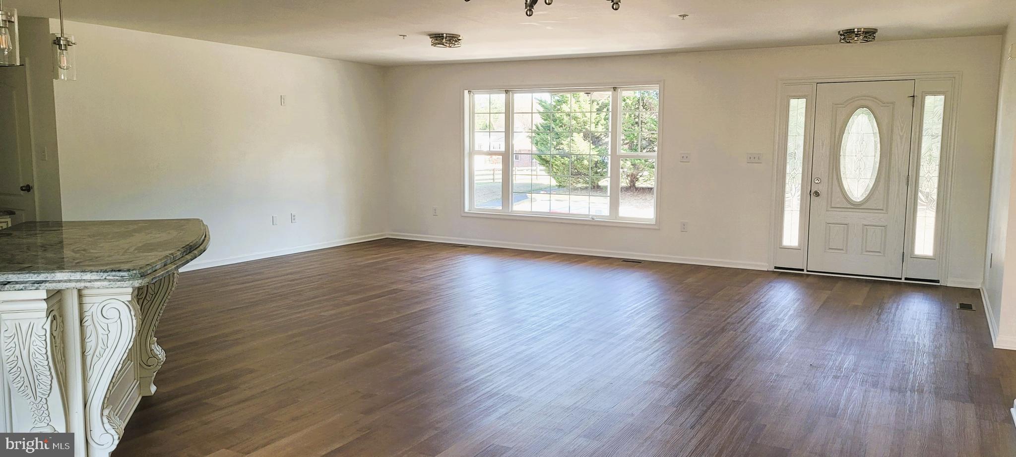 4163 Telegraph Road Elkton, MD 21921 - Photo 8 of 23 an empty room with wooden floor and windows