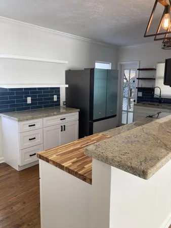 a kitchen with a stove and a sink