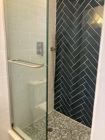 a bathroom with a toilet a sink and a mirror