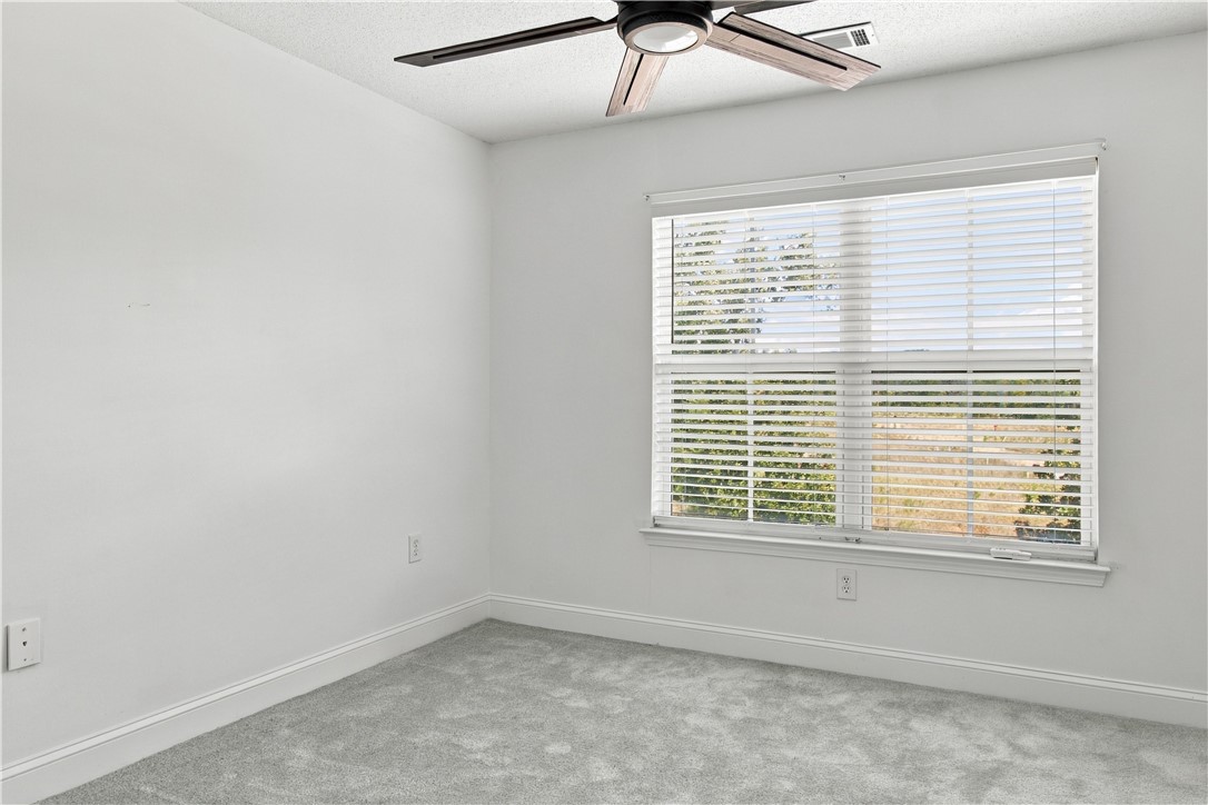 636 Lookover Drive Anderson, SC 29621 - Photo 19 of 34 Soft carpeting pairs with a large window showcasing neighborhood views.