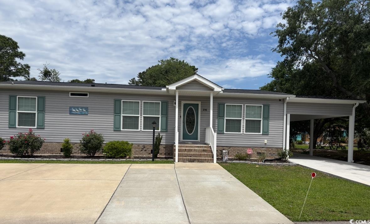 3248 Pecan Trail Murrells Inlet, SC 29576 - Photo 1 of 29 View of front of property with a carport and a fro