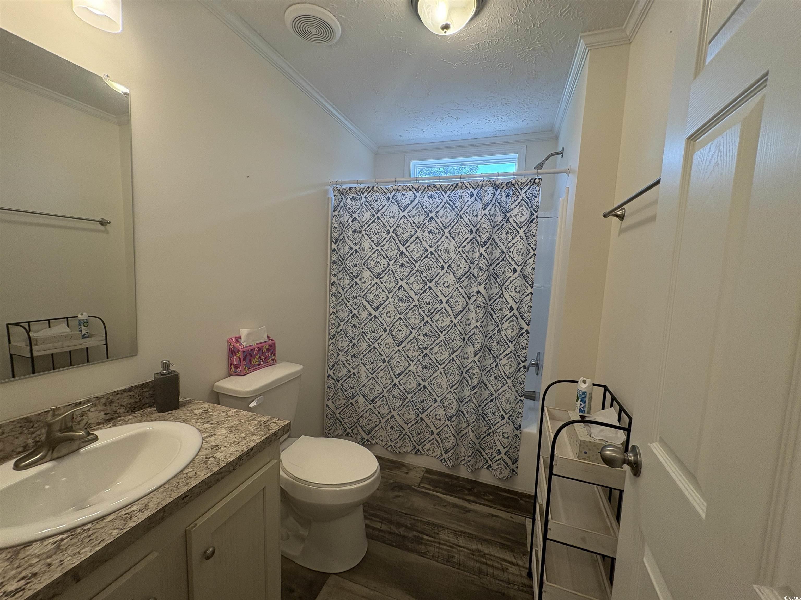 3248 Pecan Trail Murrells Inlet, SC 29576 - Photo 11 of 29 Full bathroom with crown molding, toilet, wood fin