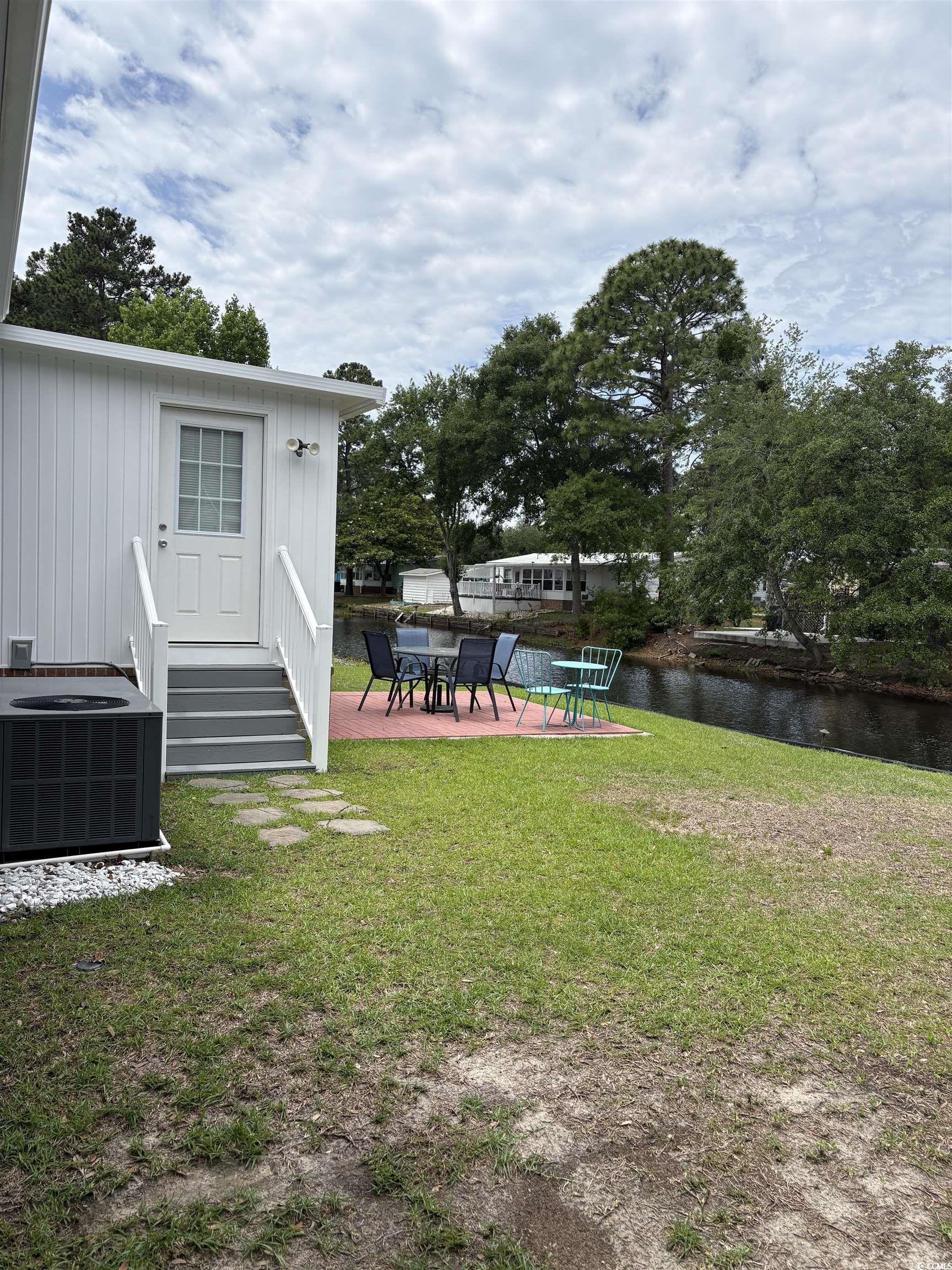 3248 Pecan Trail Murrells Inlet, SC 29576 - Photo 23 of 29 View of patio / terrace with a shed and an outbuil