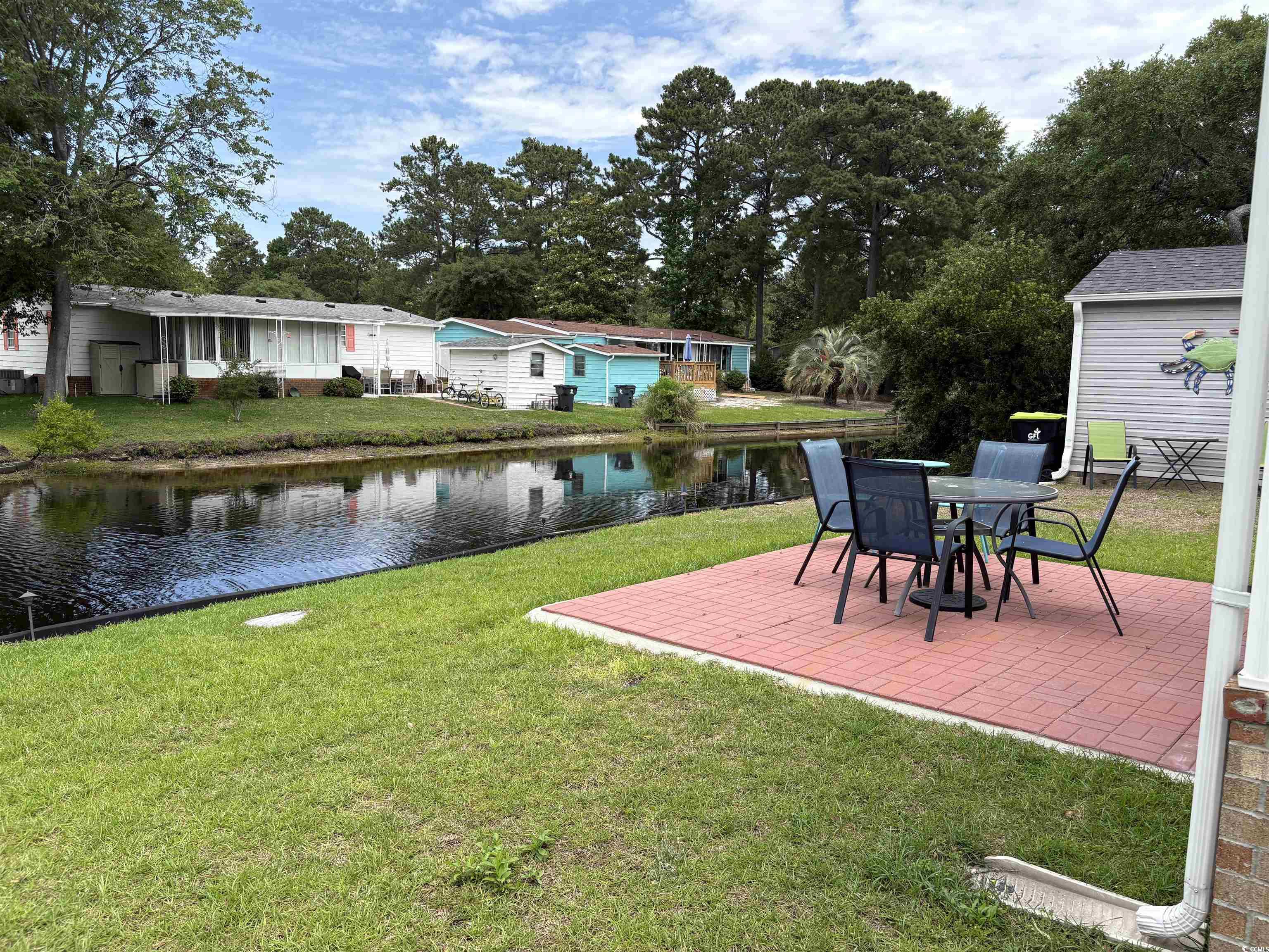 3248 Pecan Trail Murrells Inlet, SC 29576 - Photo 25 of 29 View of grassy yard featuring central AC unit, ent