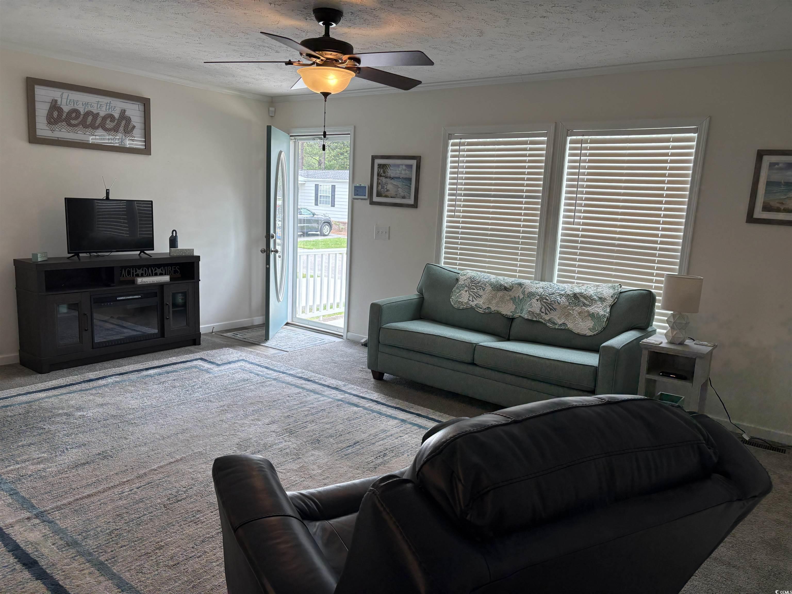 3248 Pecan Trail Murrells Inlet, SC 29576 - Photo 5 of 29 Living area with carpet, baseboards, ceiling fan,