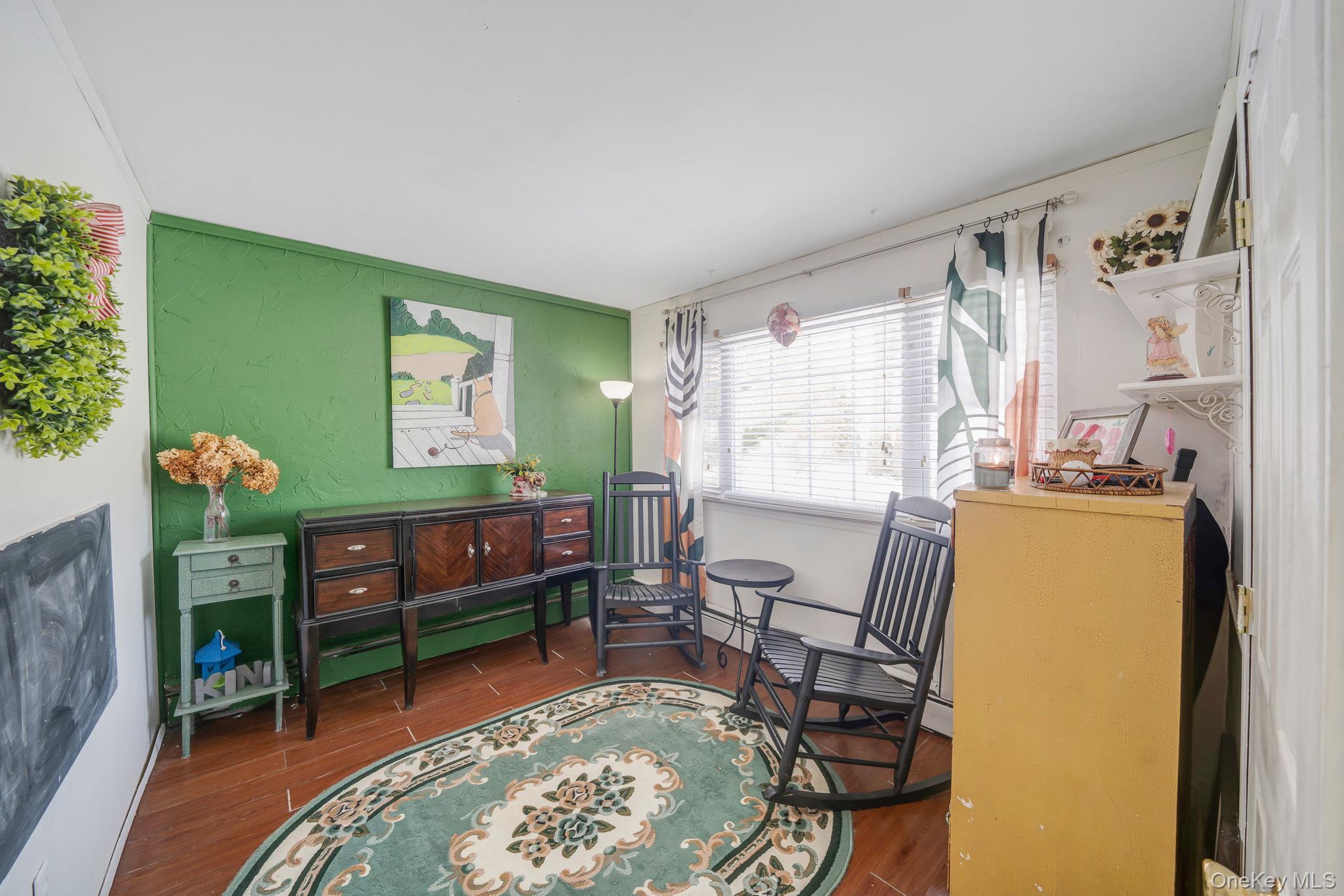 6 Howe Court Coram, NY 11727 - Photo 13 of 17 a living room with furniture and a window
